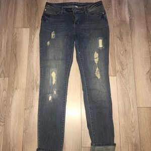 Lauren Conrad distressed skinny jeans.